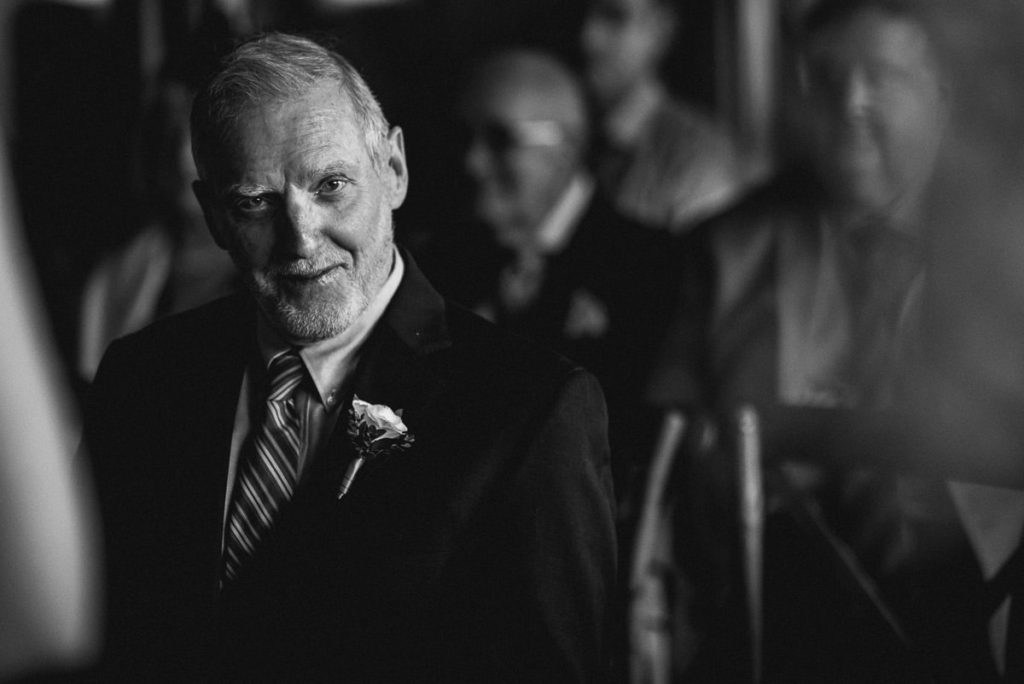 father of the bride looking at camera