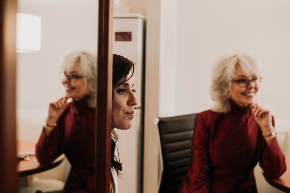 mother of bride watching bride
