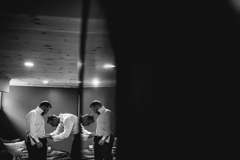 groomsman tying pants