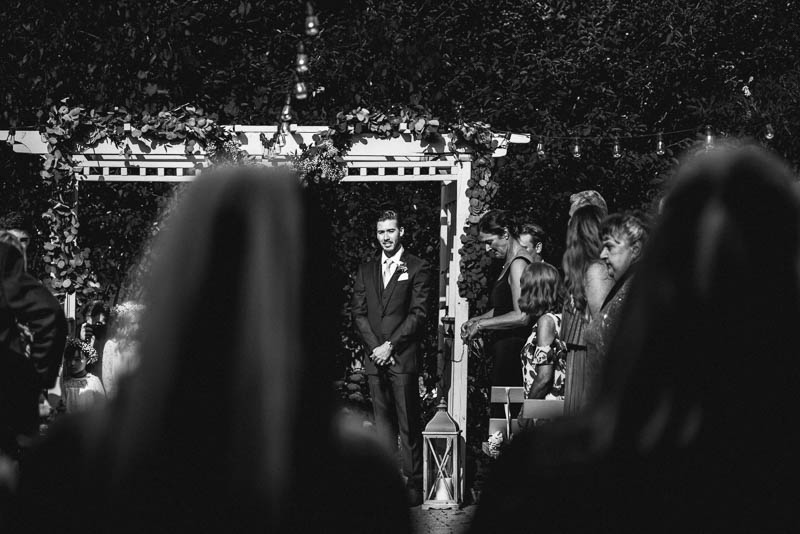 groom looking at bride walk down the aisle at strathmere