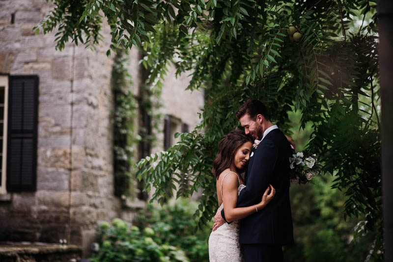 couple embrace during their formals for their wedding at strathmere