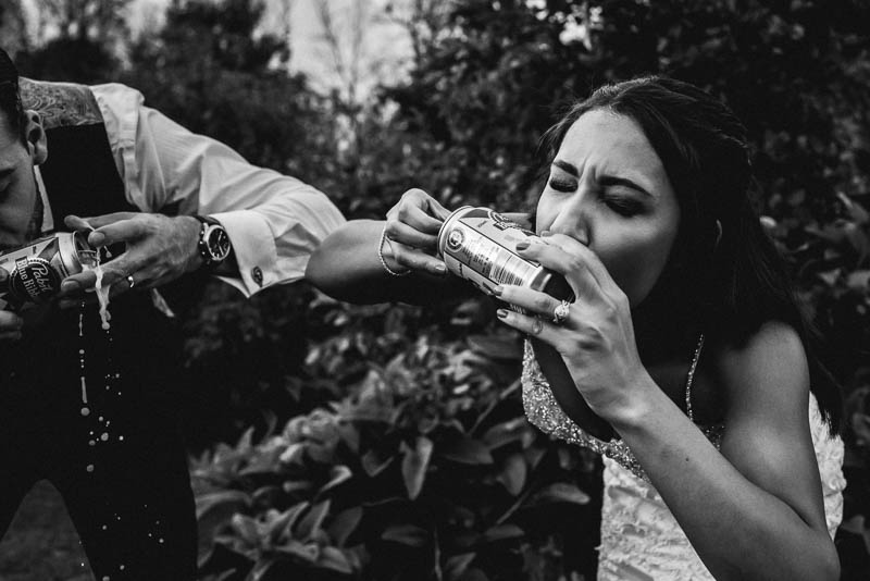 bride chugging beer during wedding at strathmere