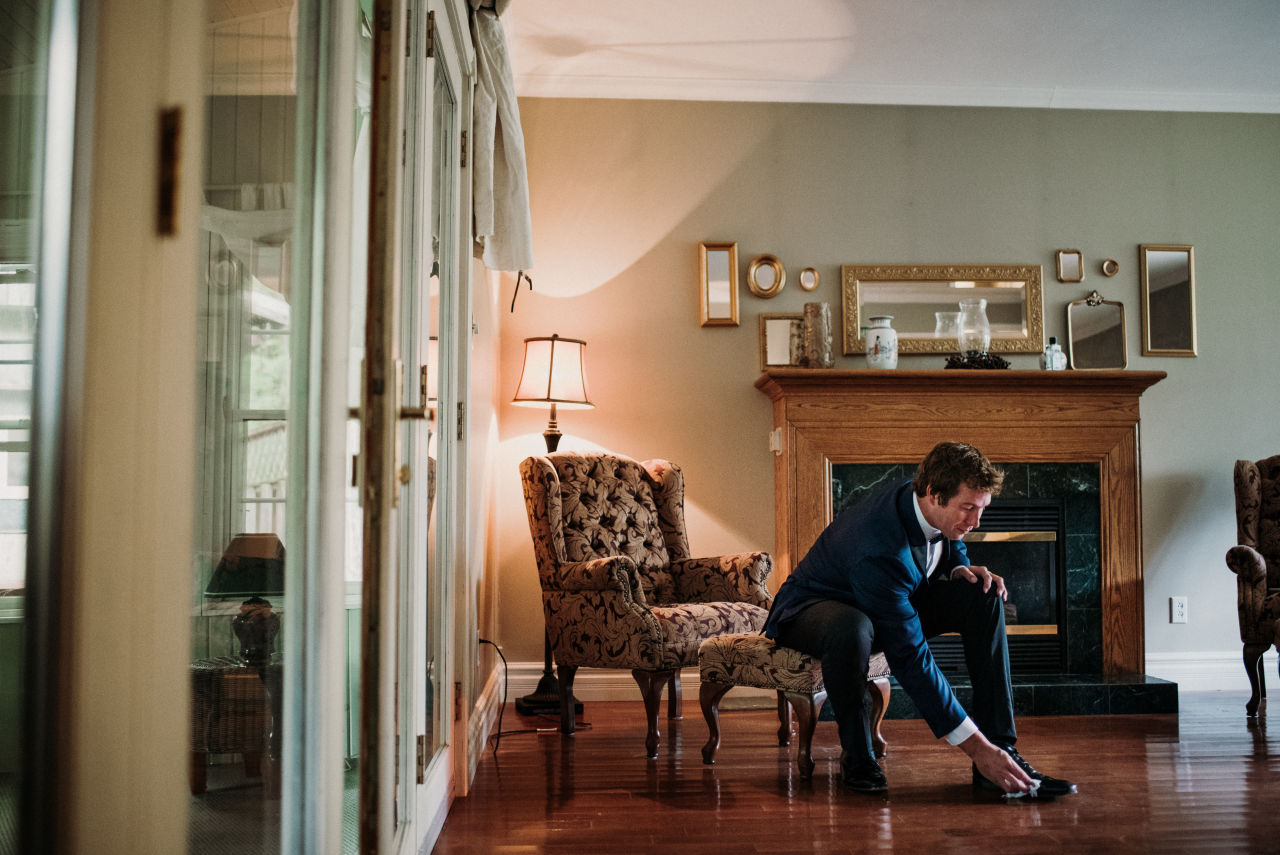 groom getting ready for his wedding at wilderness tours