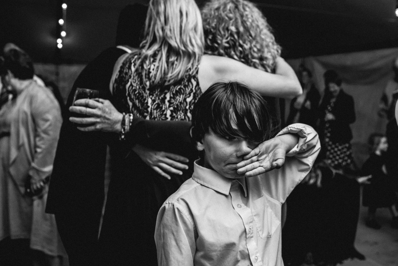 boy wiping snot from his nose at wilderness tours