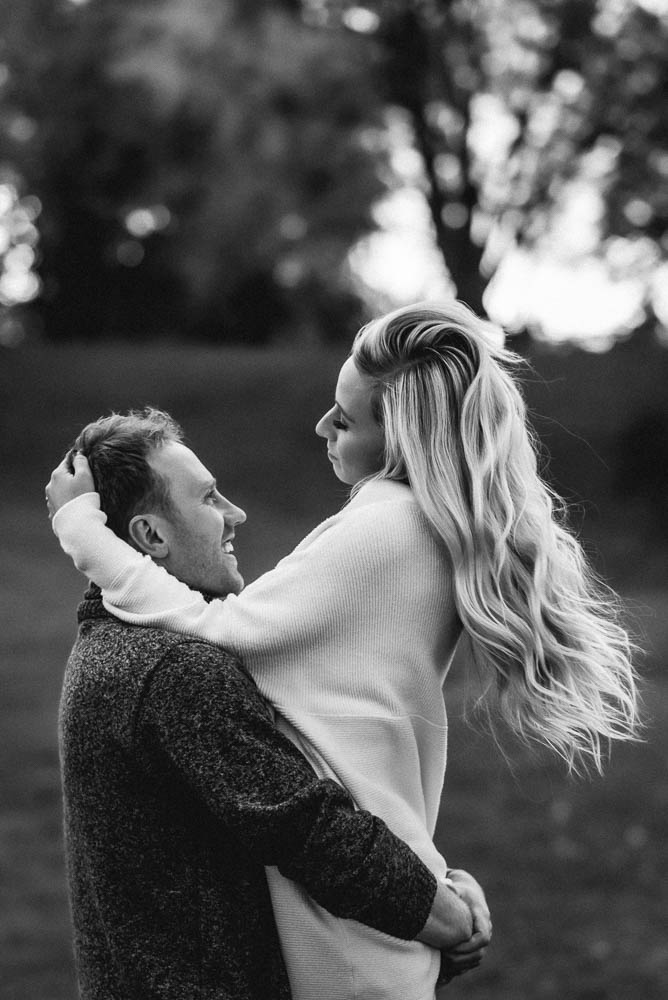 guy spinning girl around for couples session