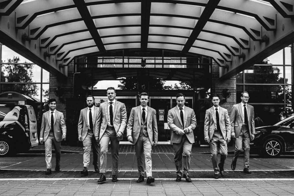 groom bridal party on their way to aquatopia wedding