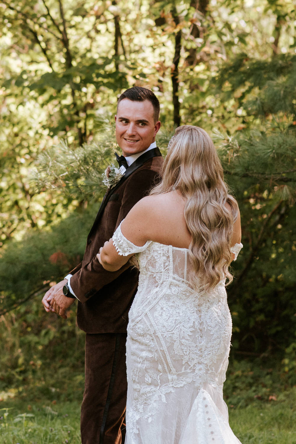 groom sees bride during first look before their wedding at tucker house