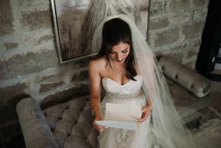 emotional photo of bride reading letter from groom
