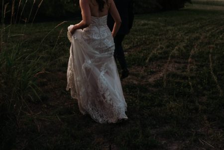 bride and groom walking during their wedding at evermore