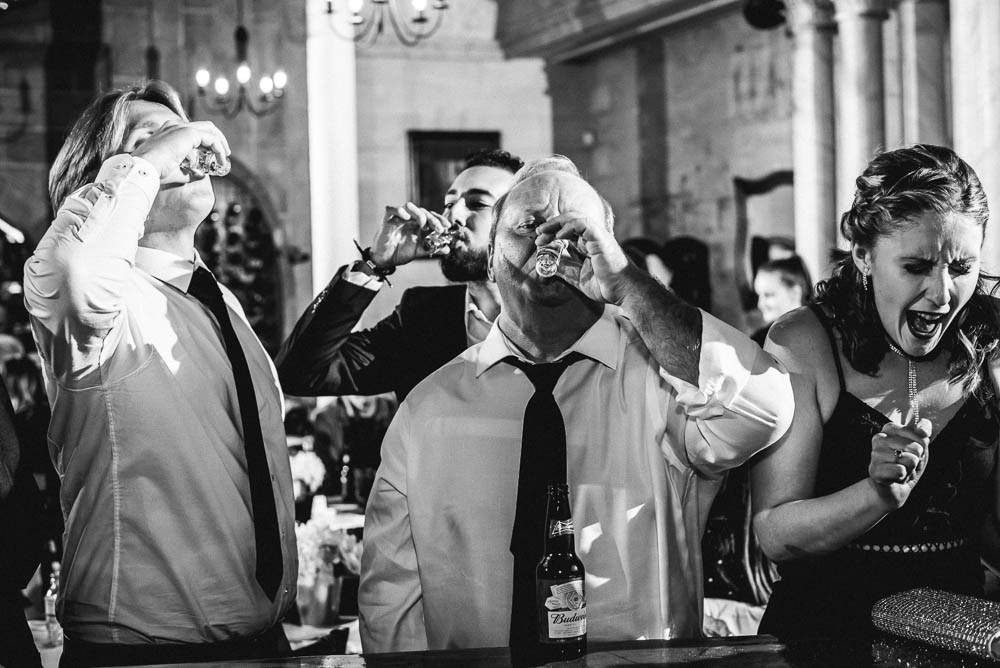 wedding guests drinking shots