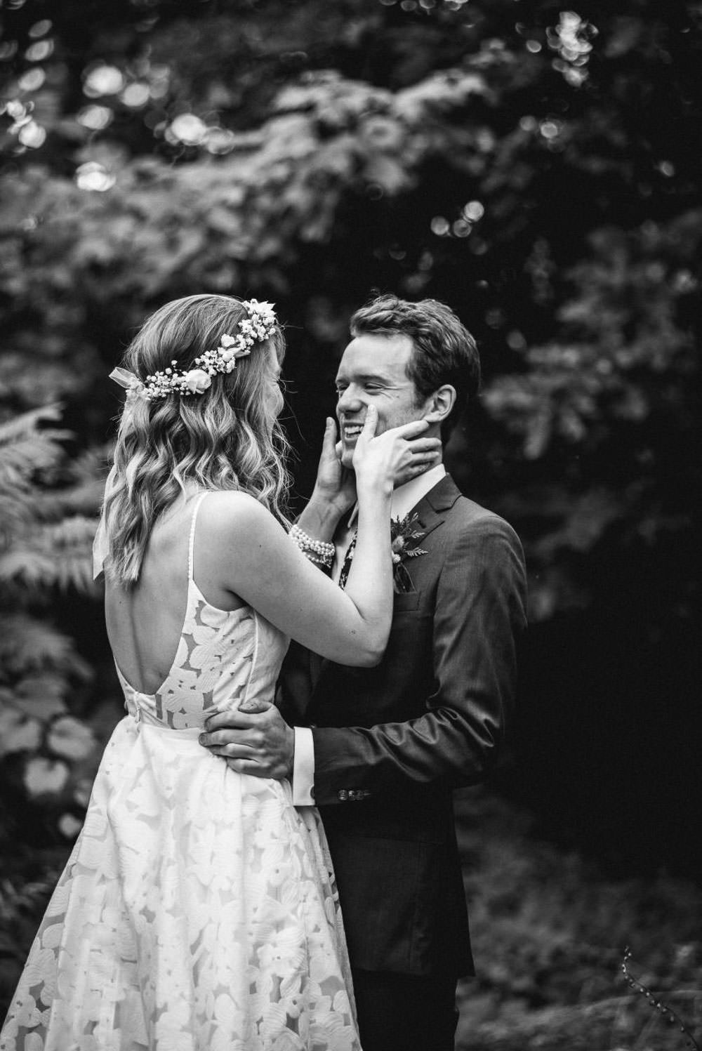 bride holding groom's face