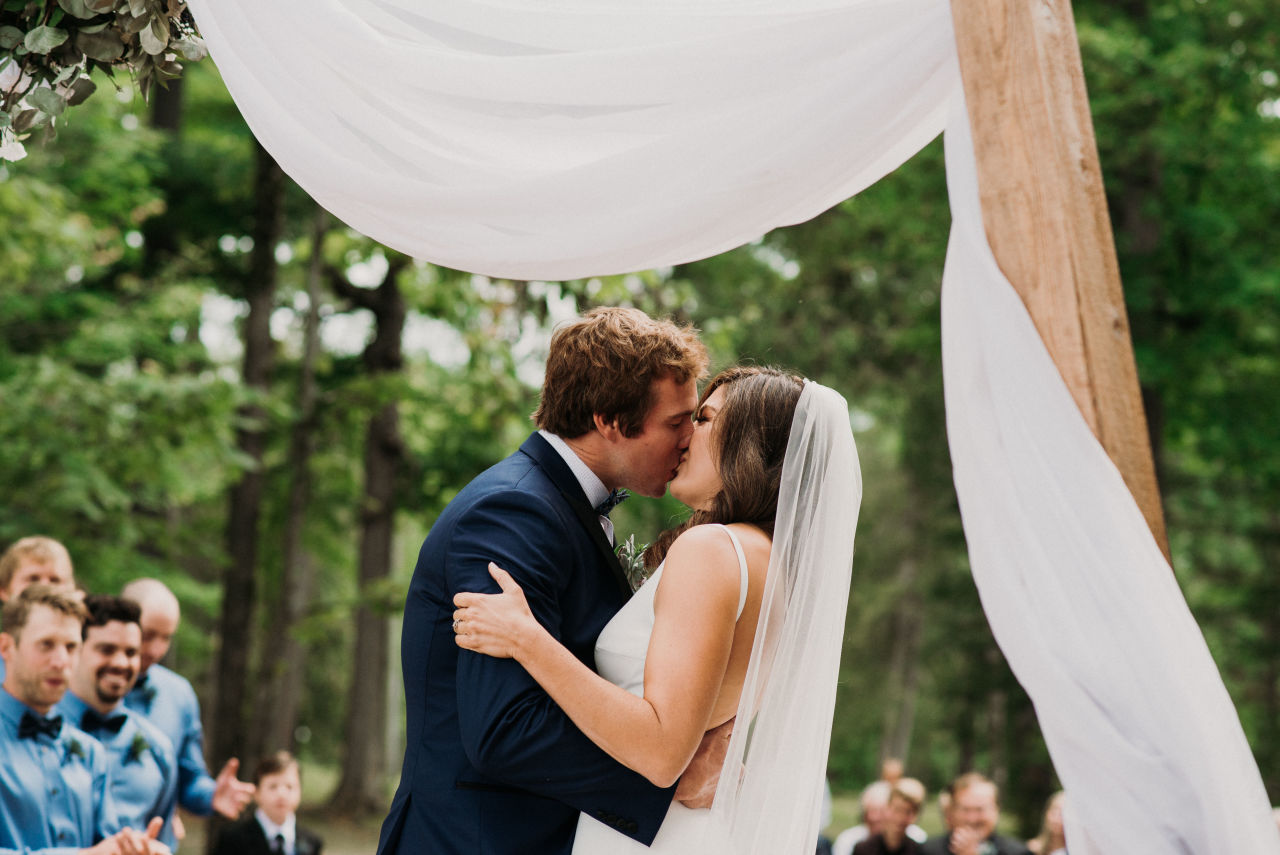 couple first kiss during wedding at wilderness tours