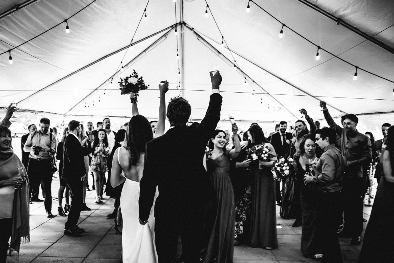 bride and groom toast their guests