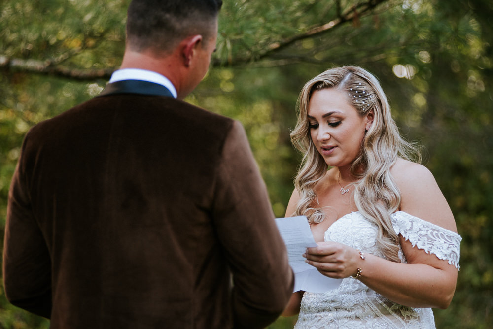 bride reads vows during first look